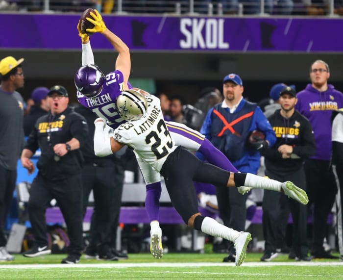 Minnesota Vikings receiver Adam Thielen (19) catches a pass against New Orleans Saints cornerback Marshon Lattimore (23). Mandatory Credit: Mark J. Rebilas-USA TODAY